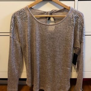 Glitzy sweater with looped back